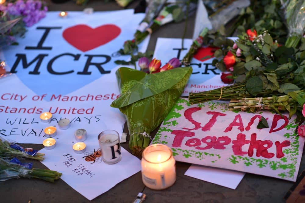 Messages and floral tributes are seen in Albert Square in Manchester, northwest England on May 23, 2017, in solidarity with those killed and injured in the May 22 terror attack at the Ariana Grande concert at the Manchester Arena. (Ben Stansall/AFP via Getty Images)
