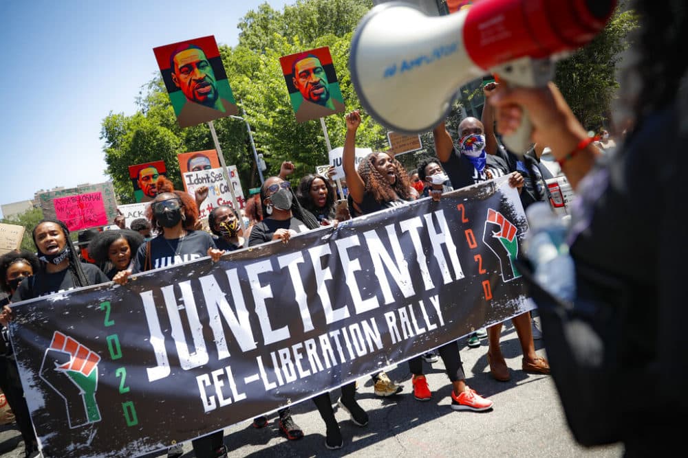 In this June 19, 2020, file photo, protesters chant as they march after a Juneteenth rally at the Brooklyn Museum, in the Brooklyn borough of New York. (John Minchillo/AP)