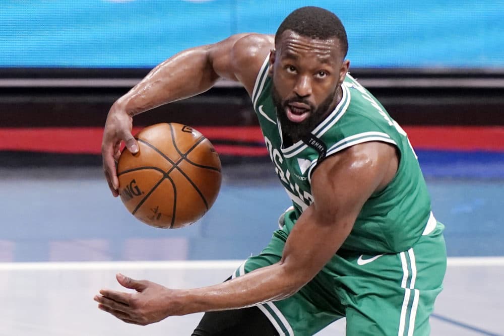 In this file photo, Boston Celtics guard Kemba Walker (8) looks for an outlet during the first quarter of Game 2 of an NBA basketball first-round playoff series against the Brooklyn Nets in New York. The Celtics traded Walker to Oklahoma City for forward Al Horford, a person with knowledge of the deal told The Associated Press on Friday. (Kathy Willens/AP)