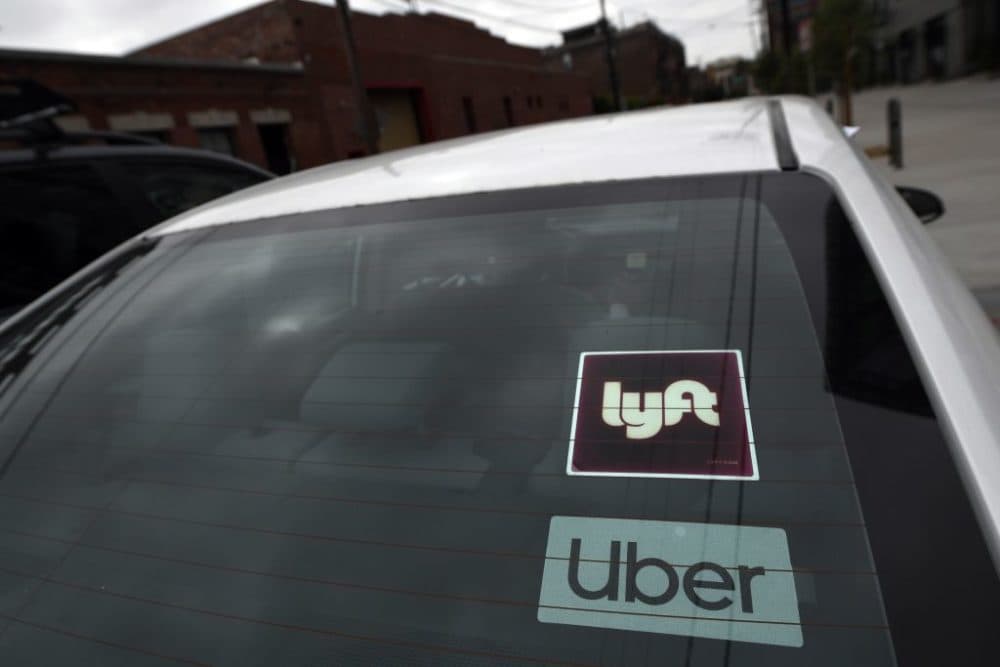 A Lyft and Uber in Los Angeles, California. (Robyn Beck/AFP/Getty Images)