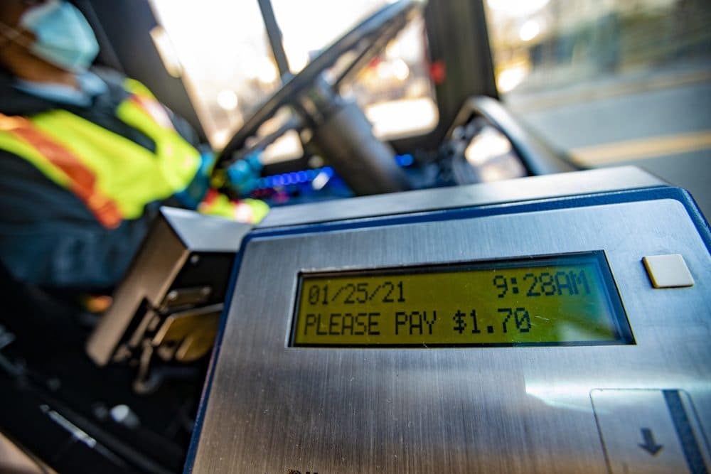 A fare machine on an MBTA bus shows the cost of a ride: $1.70. (Jesse Costa/WBUR)