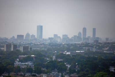 A view of the hazy Boston skyline on July 21, 2021. (Jesse Costa/WBUR)