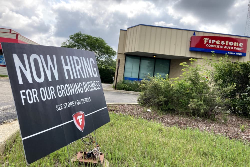 A hiring sign is displayed at Firestone Complete Auto Care store in Arlington Heights, Ill., June 30, 2021. (Nam Y. Huh/AP)