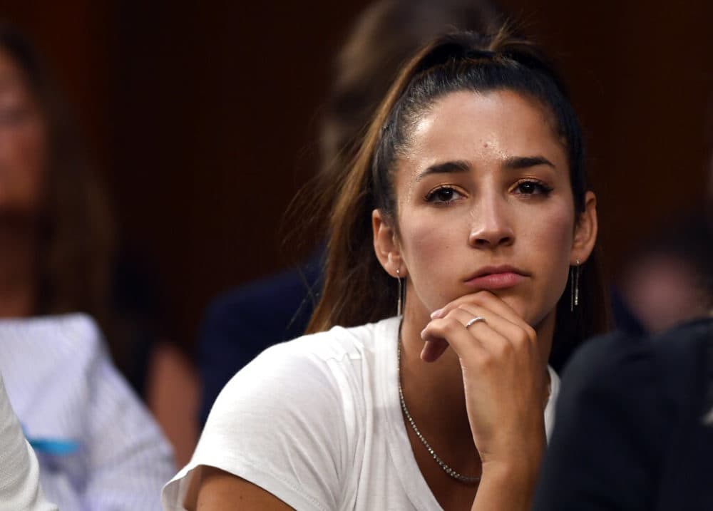 In this July 24, 2018 photo, Olympic gold medalist Aly Raisman listens to testimony during a Senate Commerce subcommittee hearing in Washington. Raisman was looking for her beloved dog, who ran away scared during a weekend fireworks show in Boston. (Susan Walsh/AP)