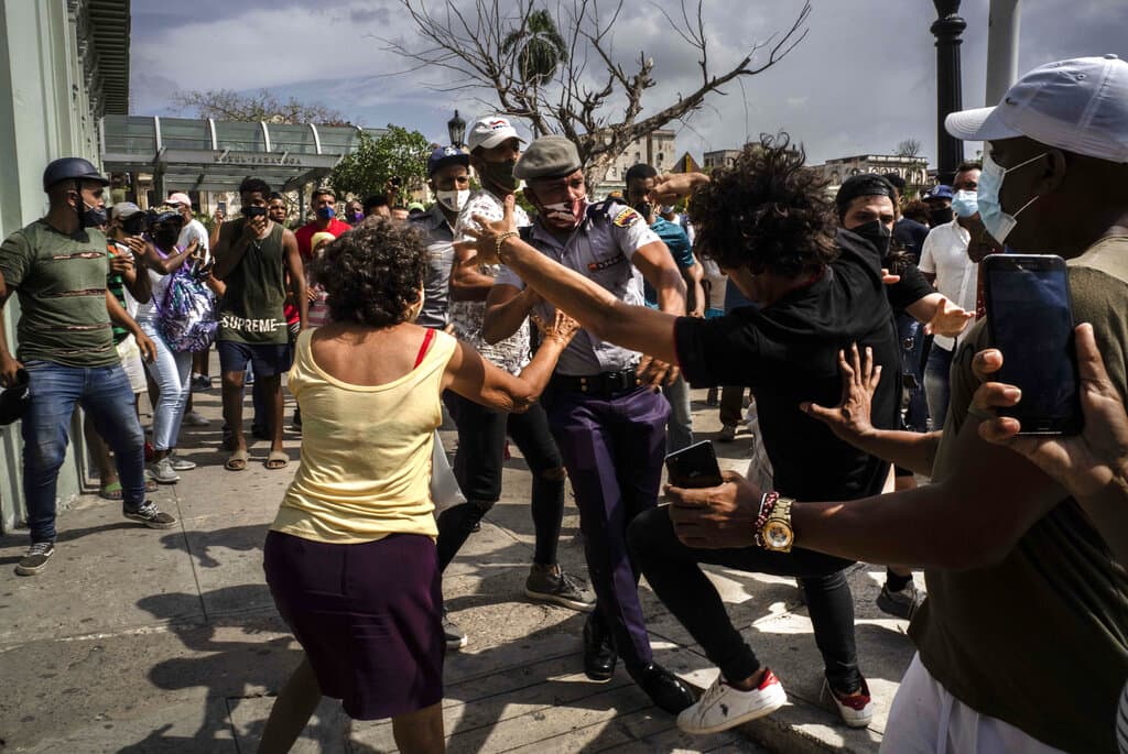Police scuffle and detain an anti-government demonstrator during a protest in Havana, Cuba, on Sunday, July 11. (Ramon Espinosa/AP)