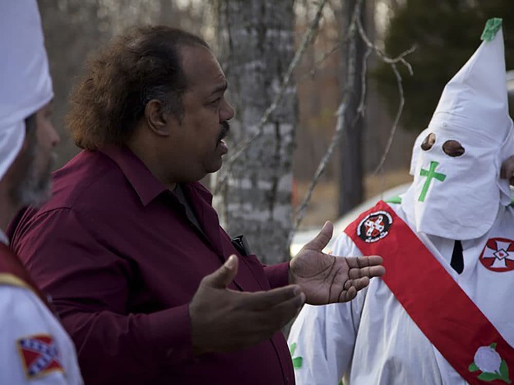 Daryl Davis in dialogue with members of the KKK. (Courtesy)