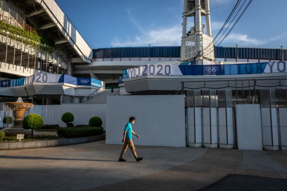 A man walks past the Yokohama Stadium, one of Tokyo Olympics venues on July 22, 2021 in Yokohama, Japan. (Yuichi Yamazaki/Getty Images)