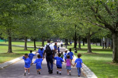 A day care class walking in a public park in Boston Common. (Jeffrey Greenberg/Universal Images Group via Getty Images)