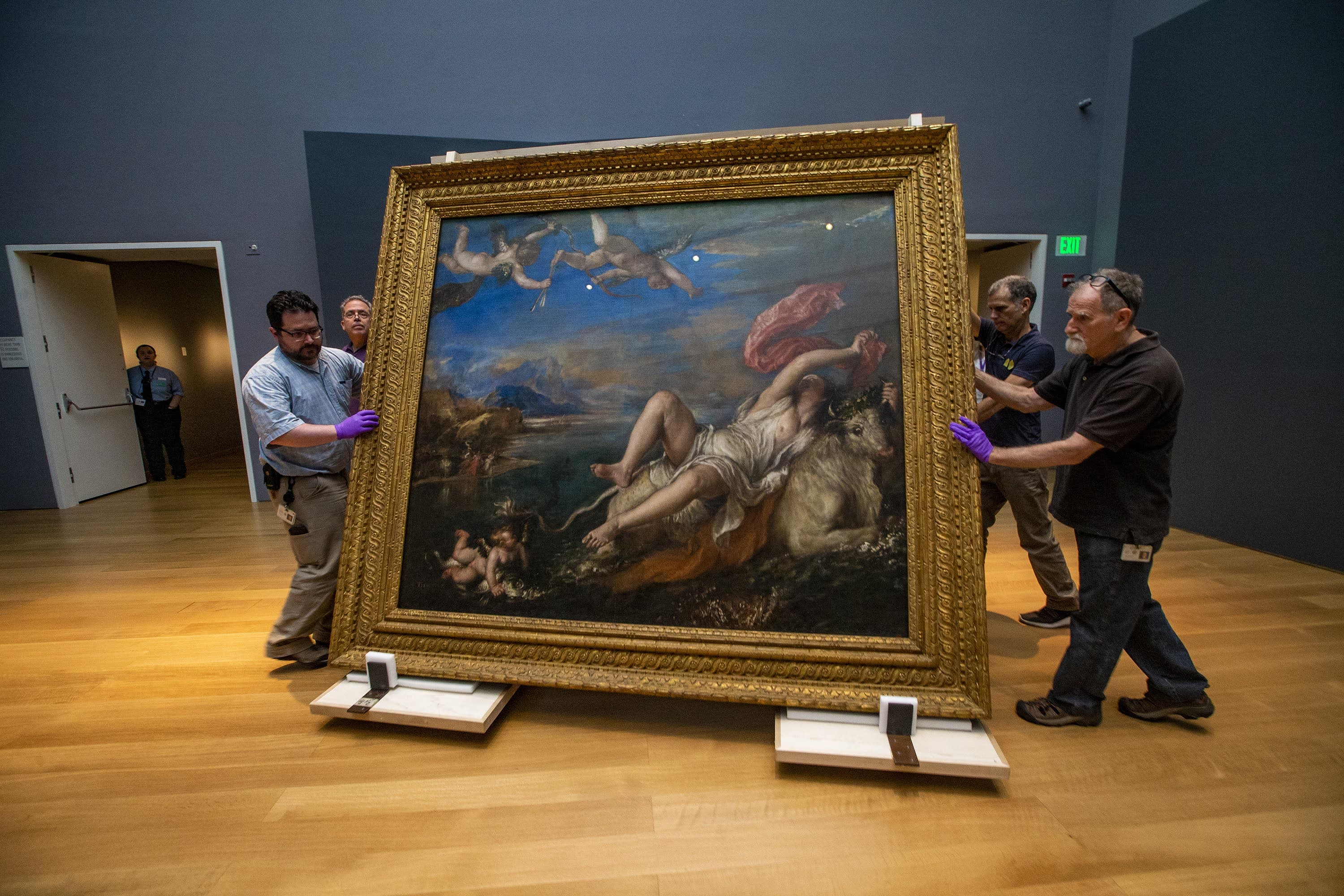 Installers move Titian’s &quot;The Rape of Europa&quot; across the Hostetter Gallery after its return to the Isabella Stewart Gardner Museum from being on loan to the Prado Museum in Madrid, Spain. (Jesse Costa/WBUR)