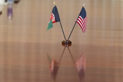 The flags of Afghanistan and the United States are seen on the table before a meeting between the Secretary of Defense Lloyd Austin and Afghan President Ashraf Ghani at the Pentagon in Washington, D.C., on June 25, 2021. (Alex Brandon/AP)
