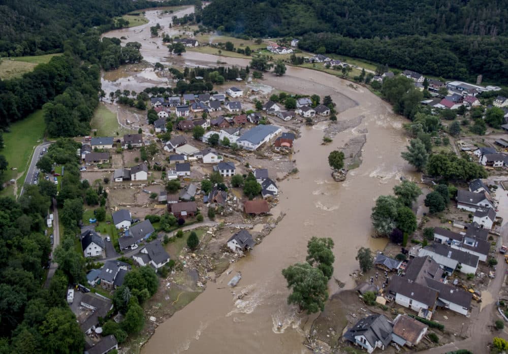 July 15, 2021: The Ahr river floats past destroyed houses in Insul, Germany. Due to heavy rain falls, the Ahr river dramatically went over the banks the evening before. The mayors of three German towns badly hit by July's deadly floods are appealing for more help from the state and federal governments, saying the disaster caused billions of euros worth of damage. (Michael Probst/AP/File)