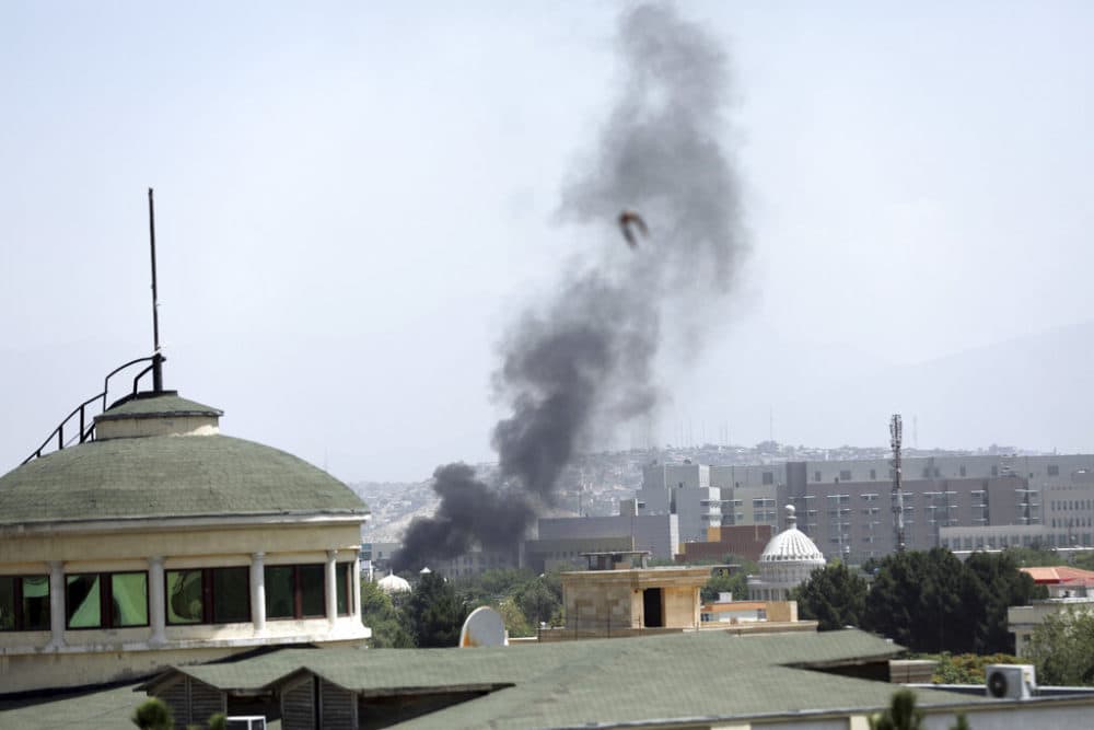 Smoke rises next to the U.S. Embassy in Kabul, Afghanistan on Sunday. (Rahmat Gul/AP)