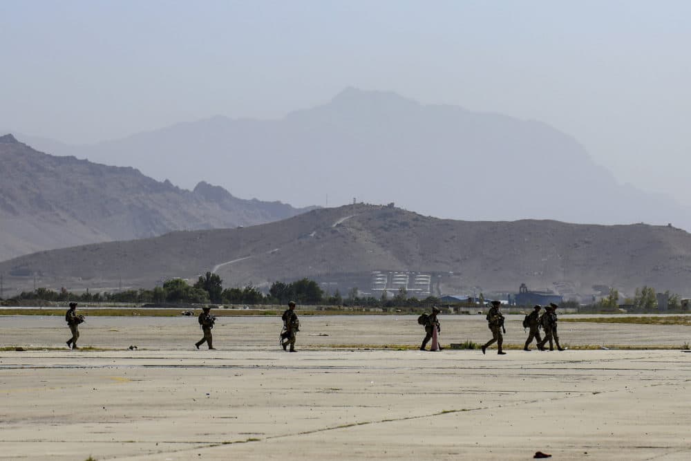 In this image provided by the U.S. Army, paratroopers assigned to the 1st Brigade Combat Team, 82nd Airborne Division conduct security operations as they continue to help facilitate the evacuation at Hamid Karzai International Airport in Kabul, Afghanistan on Aug 25, 2021. (Sgt. Jillian G. Hix/U.S. Army via AP)
