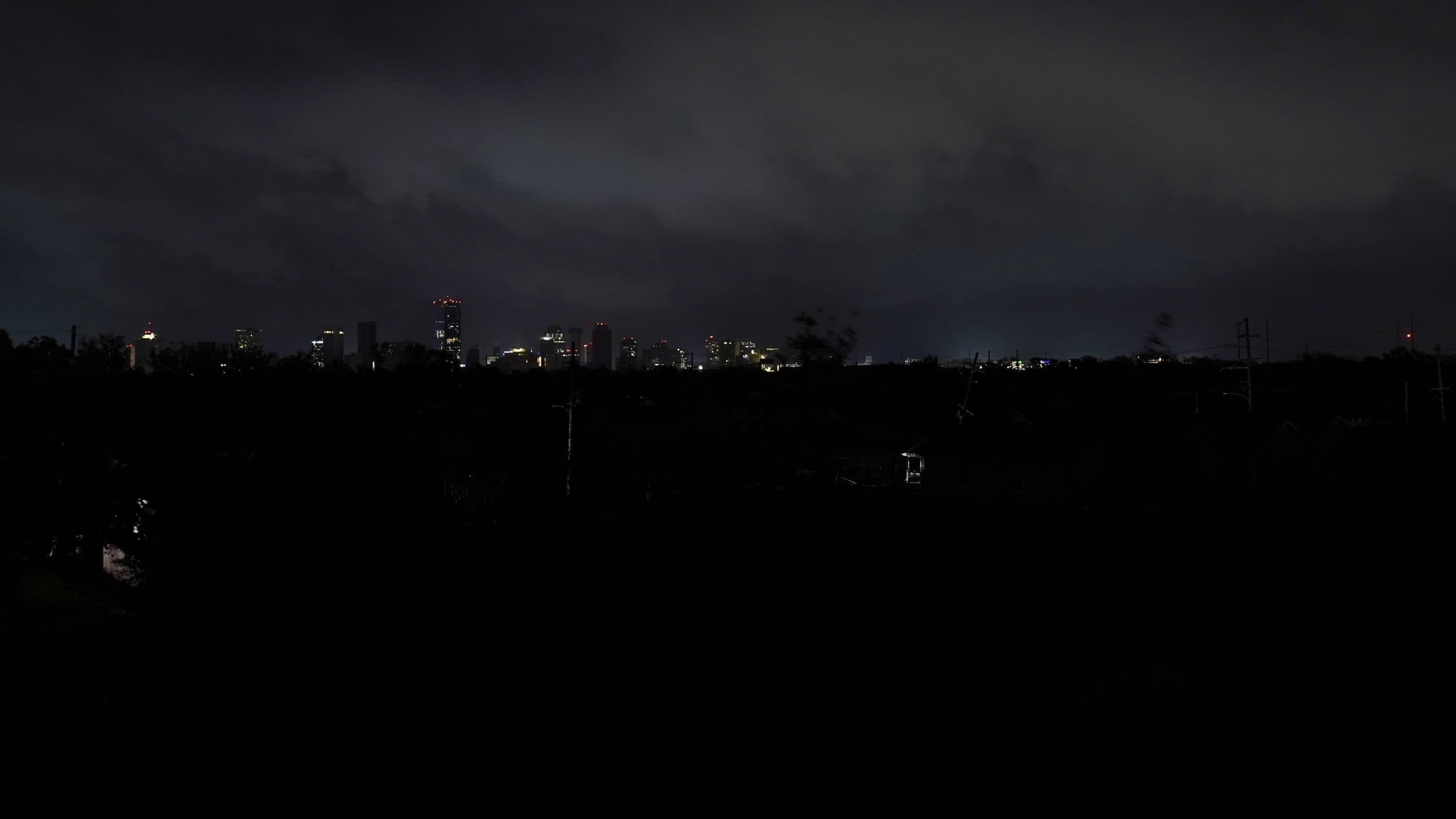 Downtown buildings relying on generator power are seen as the entire city of New Orleans is without power in the aftermath of Hurricane Ida in New Orleans, Monday, Aug. 30, 2021. (Gerald Herbert/AP Photo)