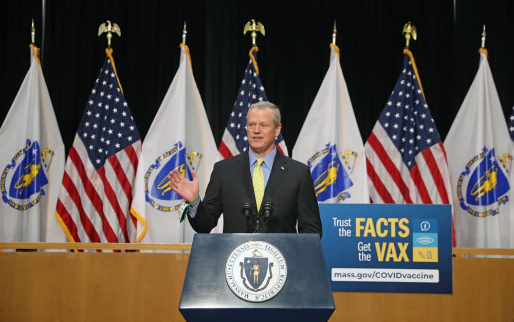 Gov. Charlie Baker, along with Lt. Governor Polito, Secretary Sudders and Secretary Kennealy, speak in the Gardner Auditorium in the Massachusetts State House in Boston on May 17, 2021. The administration announced that all business restrictions will lift on May 29 in Massachusetts. (David L. Ryan/The Boston Globe via Getty Images)