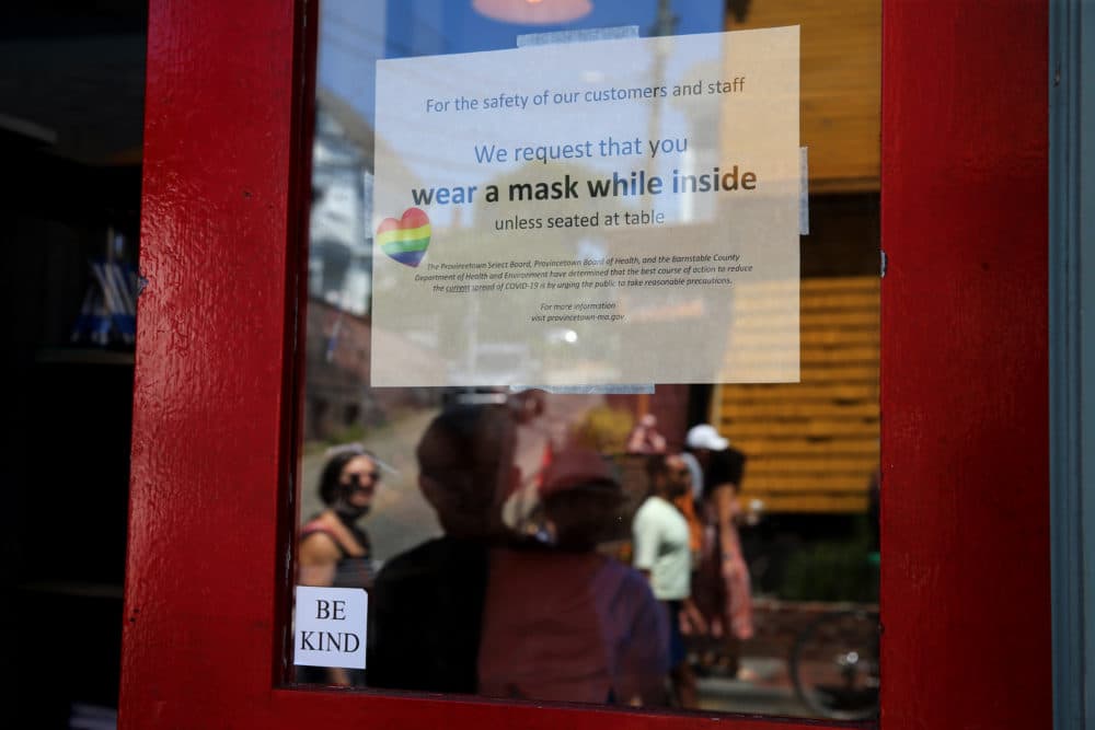 A sign at the Heaven Cafe encourages customers to wear masks until seated in Provincetown on July 24, 2021. (Craig F. Walker/The Boston Globe via Getty Images)