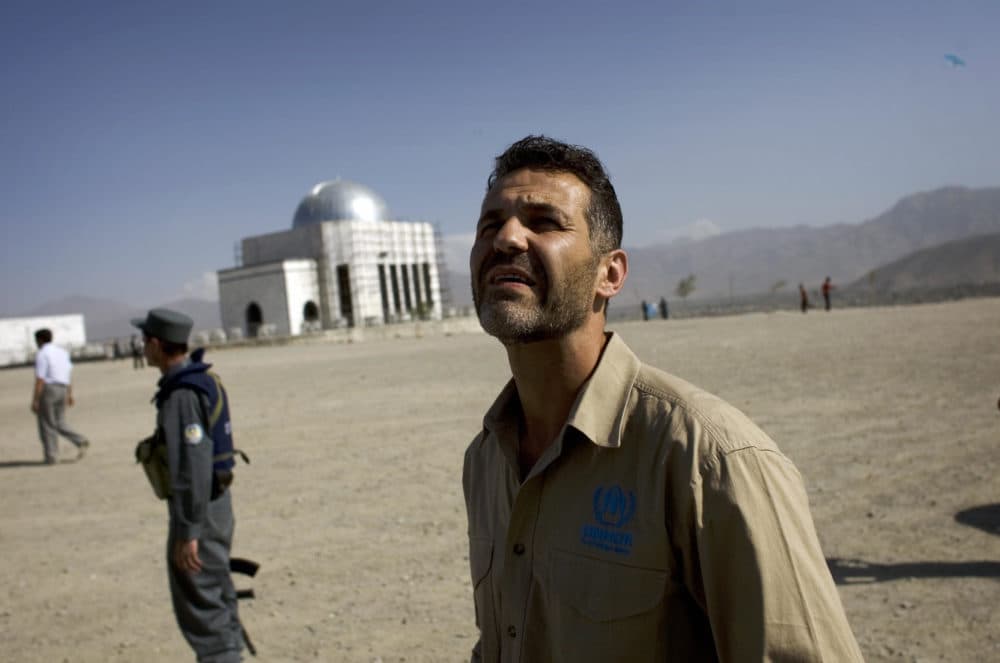 Afghan-American author Khaled Hosseini watches Afghan boys fly kites during a United Nations sponsored visit in Kabul on September 14, 2009. Hosseini, the Afghan-American author of bestselling novel &quot;The Kite Runner&quot;, flew kites with boys on a Kabul hilltop, hailing development as the key to crushing Taliban rebels. (David Furst/AFP via Getty Images)