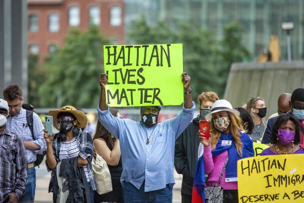 About 200 people gathered for the Solidarity with Haiti demonstration at John F. Kennedy Federal Building in Downtown Boston to protest the inhumane treatment of Haitian immigrants at the Texas border in September 2021. (Jesse Costa/WBUR)
