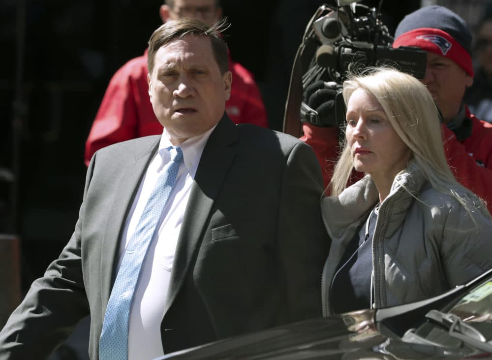 Investor John Wilson, left, at federal court in Boston with his wife Leslie on April 3, 2019. (Charles Krupa/AP)