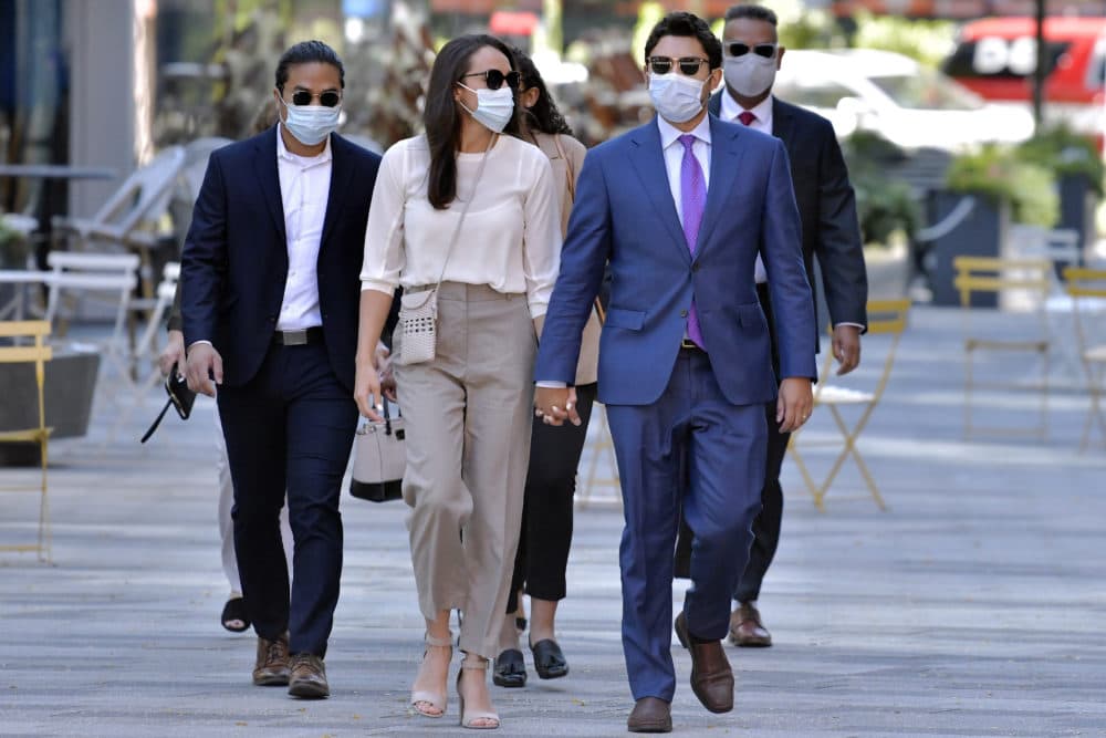 Former Fall River, Mass. Mayor Jasiel Correia, right, arrives with his wife Jenny Fernandes, center, and family members for a court appearance at the John Joseph Moakley United States Courthouse, Monday, Sept. 20, 2021, in Boston. (Josh Reynolds/ AP Photo)