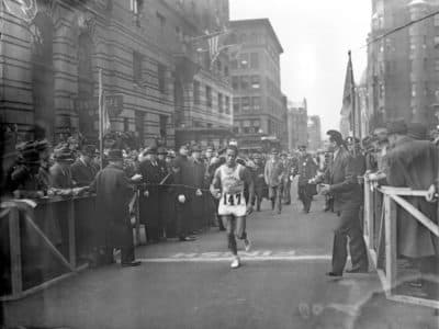 Ellison M. &quot;Tarzan&quot; Brown, a 22-year-old a member of Rhode Island's Narragansett tribe, breaks the tape to win the 1936 Boston Marathon. (File photo/AP)