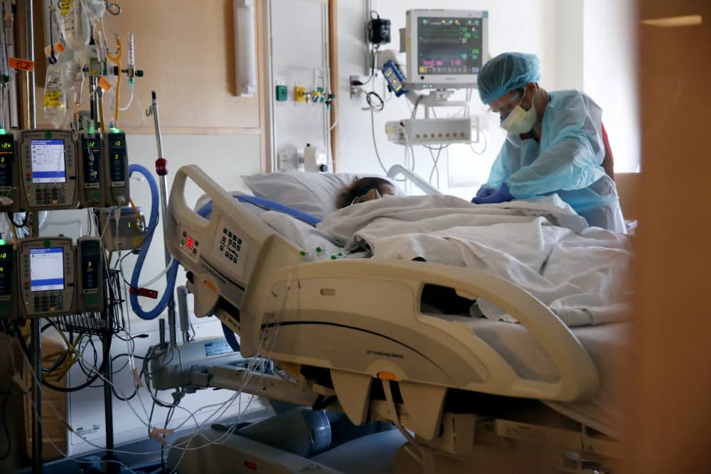 A nurse cares for a patient in the ICU at UMass Memorial Medical Center in Worcester in December 2020. (Craig F. Walker/The Boston Globe via Getty Images)