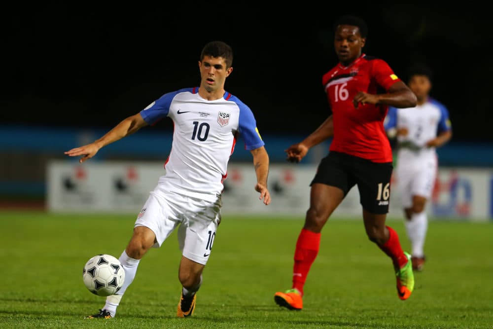 Christian Pulisic (L) of the United States mens national team runs with the ball as Levi Garcia (R) of Trinidad and Tobago chases him down during the FIFA World Cup Qualifier match between Trinidad and Tobago at the Ato Boldon Stadium on Oct. 10, 2017 in Couva, Trinidad And Tobago. (Ashley Allen/Getty Images)