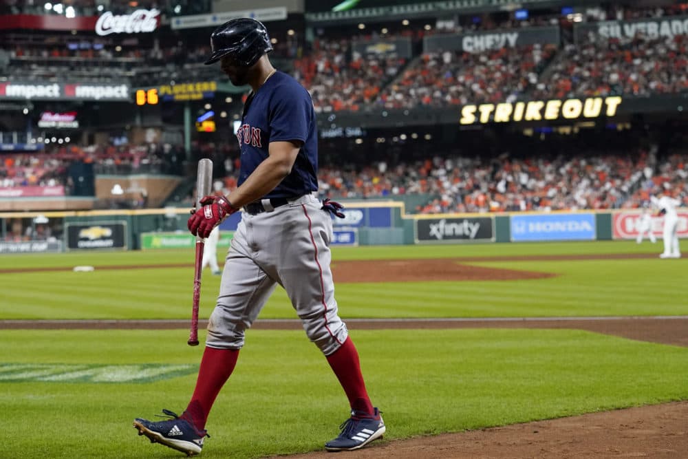 Boston Red Sox's Xander Bogaerts walks to the dugout after striking out against the Houston Astros during the seventh inning in Game 6 of baseball's American League Championship Series Friday, Oct. 22, 2021, in Houston. (Tony Gutierrez/AP)