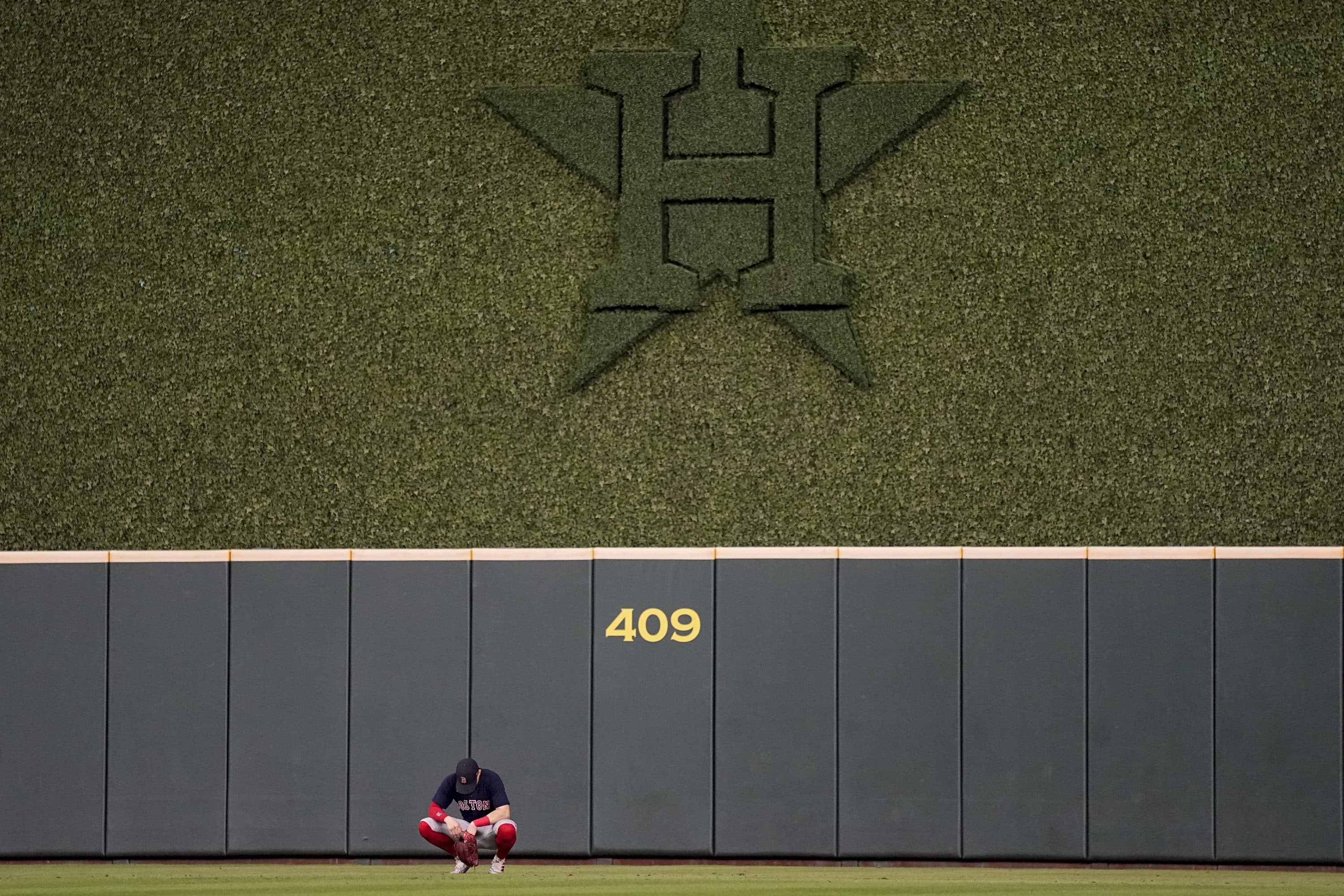 Boston Red Sox center fielder Enrique Hernandez waits in the outfield during the eighth inning in Game 6 of baseball's American League Championship Series Houston Astros Friday, Oct. 22, 2021, in Houston. (David J. Phillip/AP)