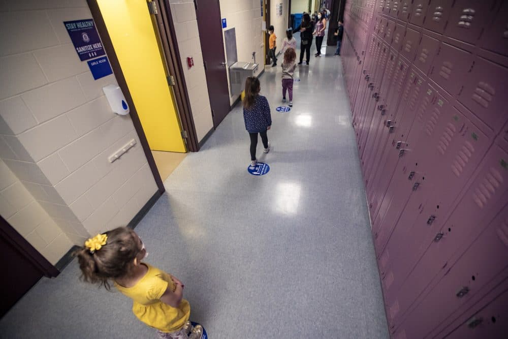 Young students at a Massachusetts school follow COVID protocols in place in March of 2021. (Jesse Costa/WBUR)