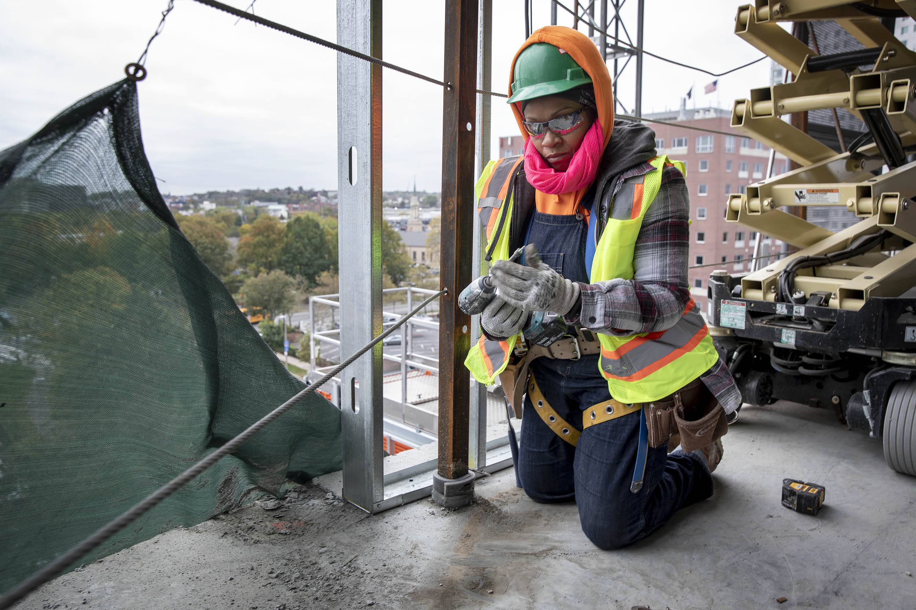 Eyoda Williams, a first year apprentice in carpentry, works on a construction site in Boston. (Robin Lubbock/WBUR)