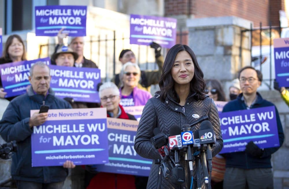 Michelle Wu talks to reporters after voting in Roslindale. (Robin Lubbock/WBUR)