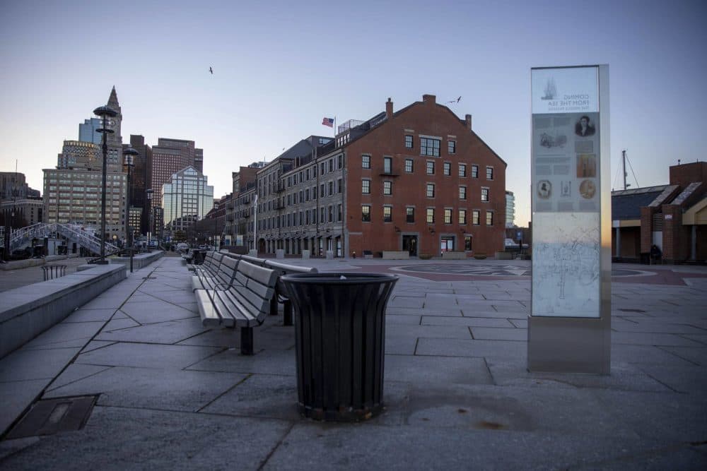 A pillar stands on Long Wharf in Boston to mark the spot where ships would arrive and leave with Africans to be sold into slavery. (Robin Lubbock/WBUR)