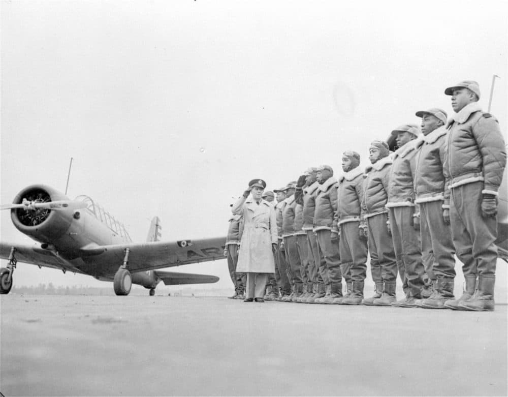Major James A. Ellison, left, returns the salute of Mac Ross of Dayton, Ohio, as he inspects the cadets at the Basic and Advanced Flying School for Black United States Army Air Corps cadets at the Tuskegee Institute in Tuskegee, Ala., in Jan. 23, 1942. (AP Photo/U.S. Army Signal Corps, File)