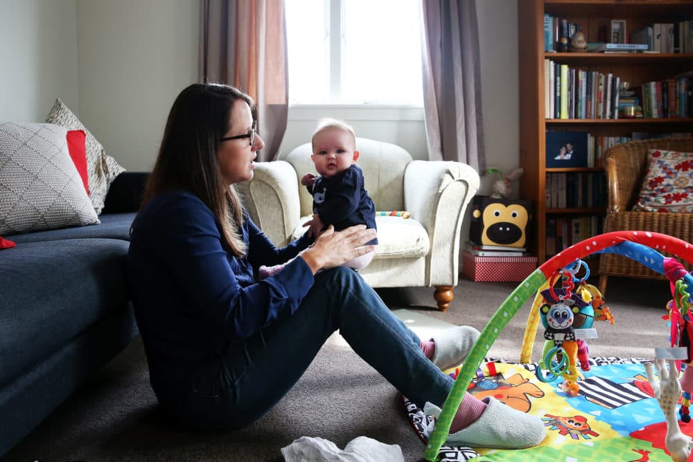 Secondary school teacher Sarah Ward at home on maternity leave with her three month old daughter Esme Kelliher, is in the last week of her paid parental leave allowance ahead of the New Zealand Federal Budget release, on May 5, 2015 in Auckland, New Zealand. (Fiona Goodall/Getty Images)