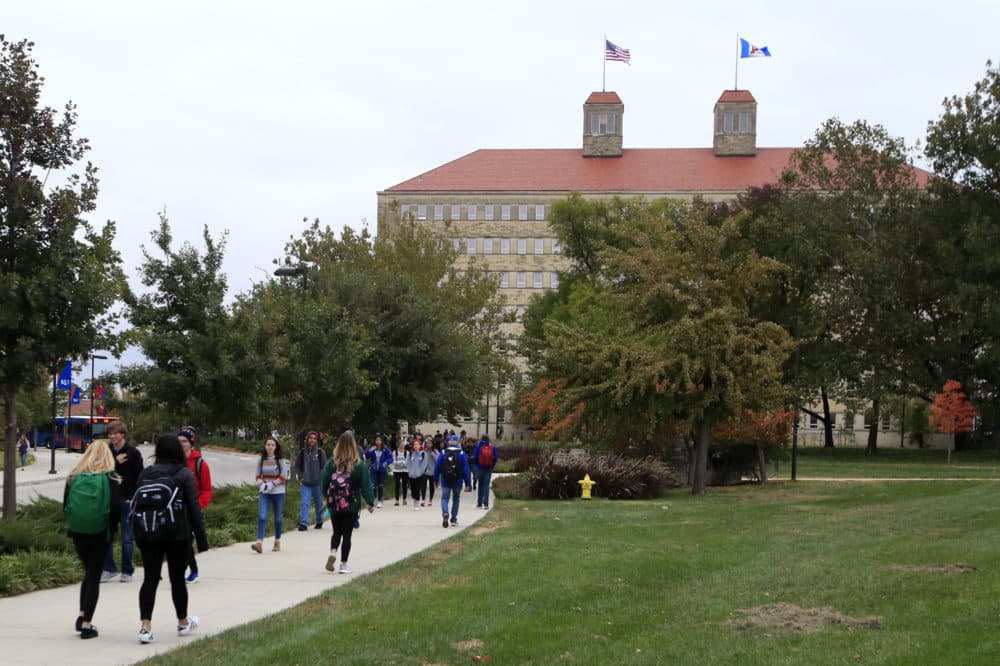 Students walk in front of Fraser Hall on the University of Kansas campus in Lawrence, Kan. (Orlin Wagner/AP)