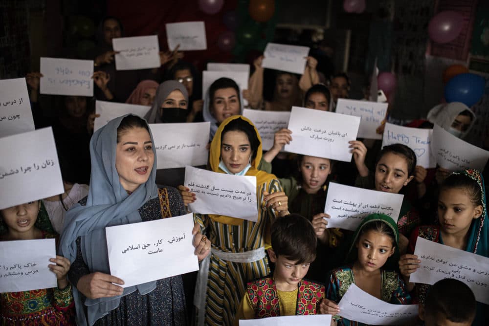 Women and teachers demonstrate inside a private school to demand their rights and equal education for women and girls, during a gathering for National Teachers Day, at a private school in Kabul, Afghanistan, on Oct. 5, 2021. (Ahmad Halabisaz/AP)
