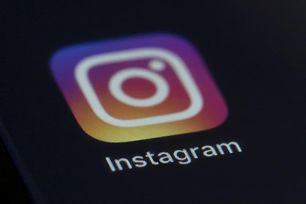The Instagram app icon on the screen of a mobile device. (Jenny Kane/AP)