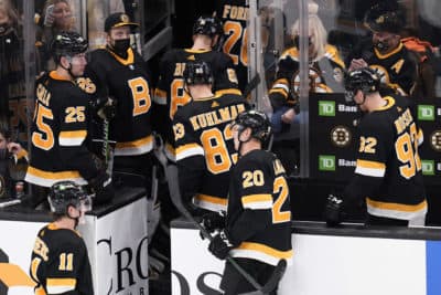 The Boston Bruins head to the locker room after a game against the Vegas Golden Knights, Dec. 14, 2021, in Boston. (Charles Krupa/AP)