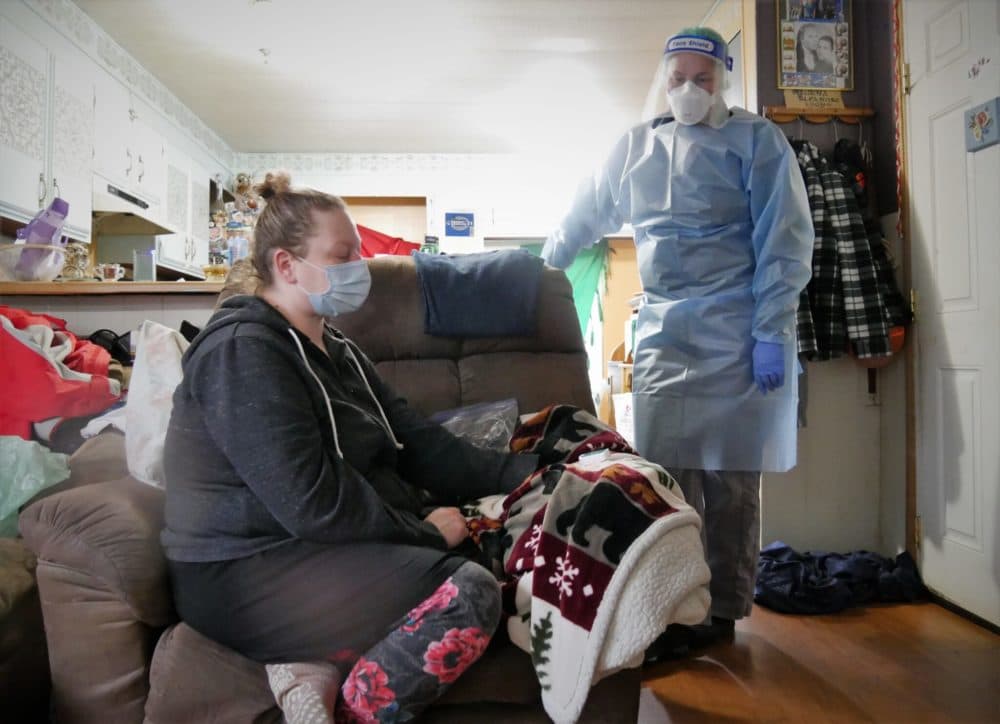 Home Health Manager Kirsten Testoni visits Natocha Lyons, 43, who is quarantining at home with COVID, Nov. 24. (Angela Denning/KFSK)