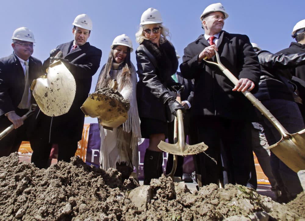 Officials wield shovels, including from third left, Tribal Council member Winnie Johnson Graham, state representative Shaunna O'Connell, and Taunton Mayor Thomas Hoye during an official groundbreaking, April 5, 2016, in Taunton, Mass., where the Mashpee Wampanoag tribe hopes to build a resort casino. The tribe scored a major victory in its years long battle to preserve its reservation in December 2021, but it doesn't mean the Massachusetts tribe's path to building a resort casino on the sovereign lands has become any clearer. (Elise Amendola/AP)
