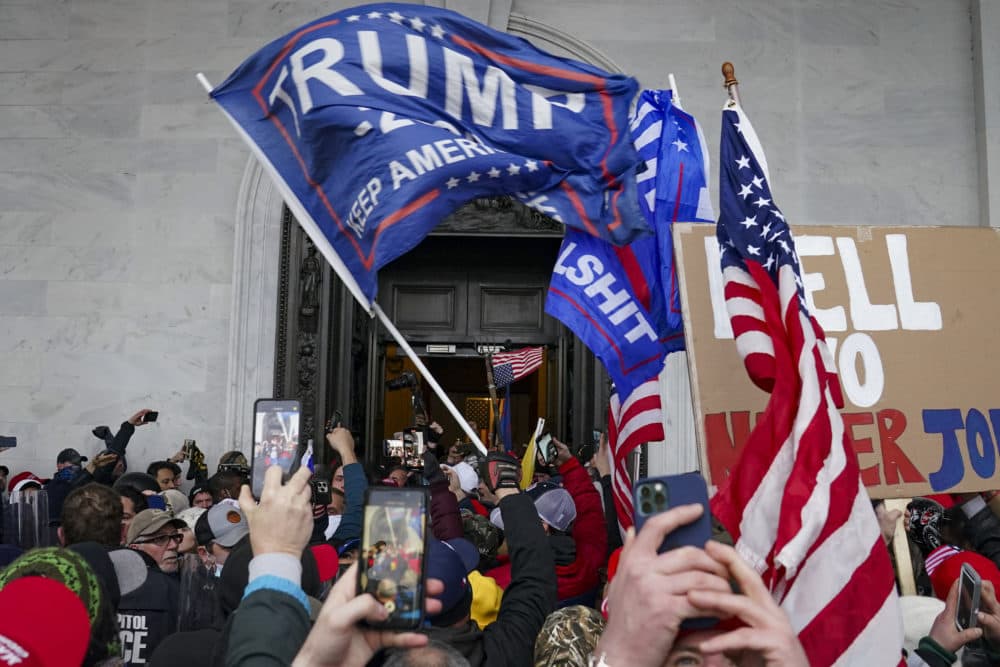 On Jan. 6, 2021, rioters break into the Capitol in Washington. (John Minchillo/AP)