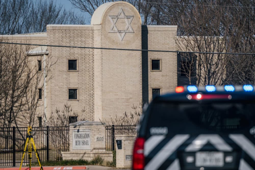 A law enforcement vehicle sits in front of the Congregation Beth Israel synagogue on January 16, 2022 in Colleyville, Texas. All four people who were held hostage at the Congregation Beth Israel synagogue have been safely released after more than 10 hours of being held captive by a gunman. (Brandon Bell/Getty Images)