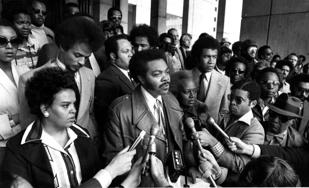 Massachusetts State Sen. William Owens (center) addresses a press conference in City Hall Plaza in Boston on April 6, 1976, the day after the assault on Ted Landsmark. Others prominent in photo: State Rep. Doris Bunte and Royal Bolling Jr. (left of Sen. Owens), State Rep. Mary Goode (right of Sen. Owens), Wayne Budd Pres. of Black Lawyers Association, and Otto Snowden (wearing hat) founder of Freedom House. (Ted Dully/The Boston Globe via Getty Images)