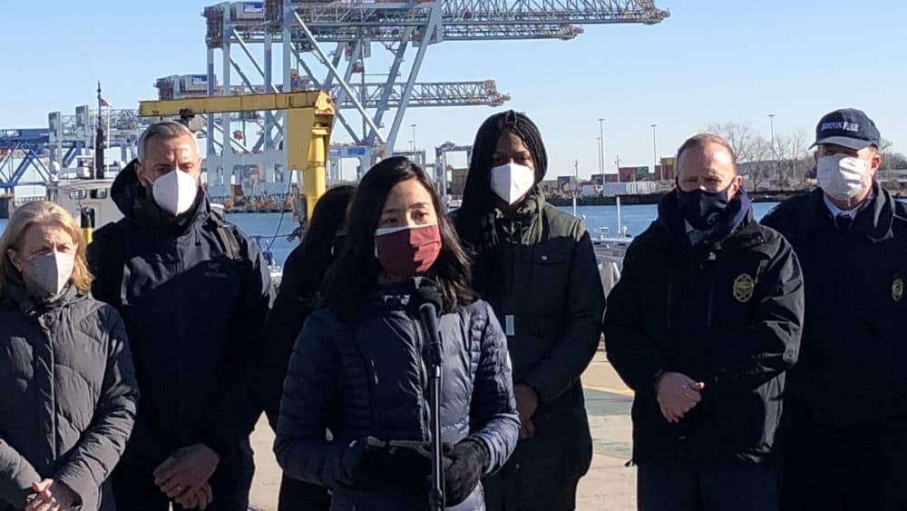 Boston Mayor Michelle Wu speaks with reporters on Long Island in Boston Harbor. (Deborah Becker/WBUR)