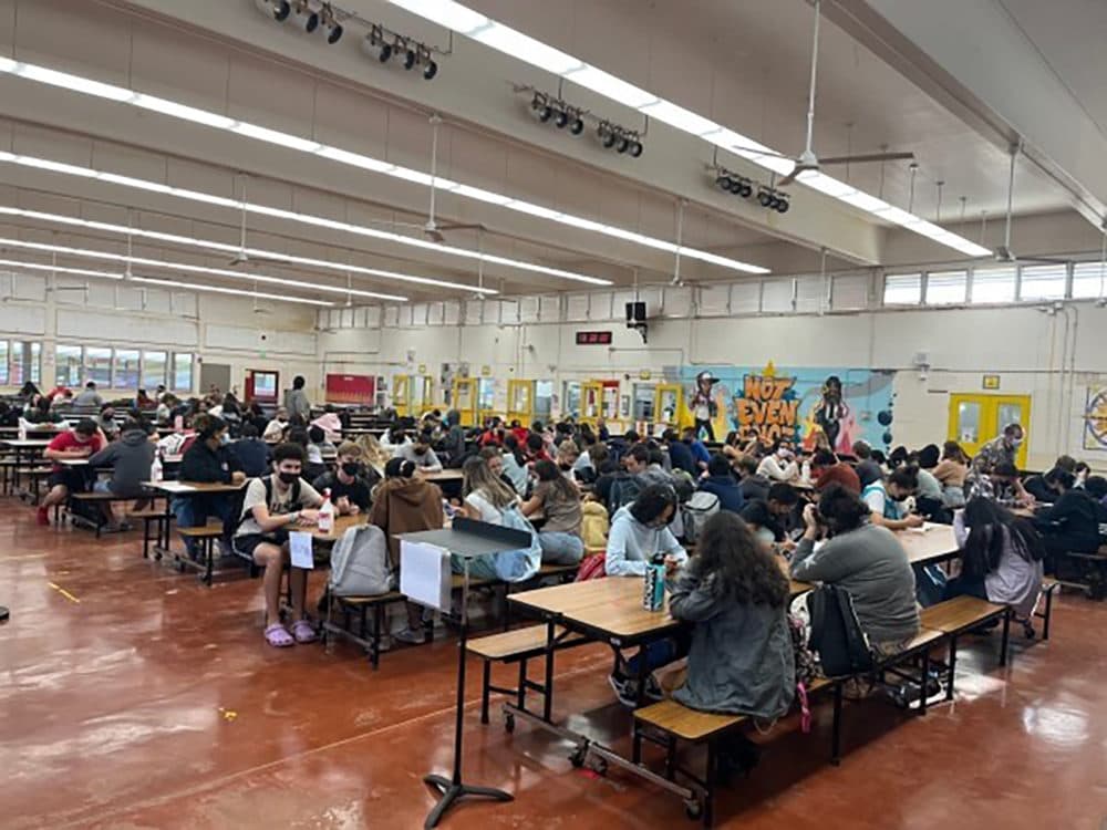 This picture went viral at the start of the month. It shows students being put into their cafeteria with no work to do, sitting without any social distancing, and bored on their phones. The picture was taken at Kahuku High and Intermediate School. So many teachers were out due to COVID that students were put in a cafeteria to be supervised by security guards. (Courtesy of Osa Tui Jr.)
