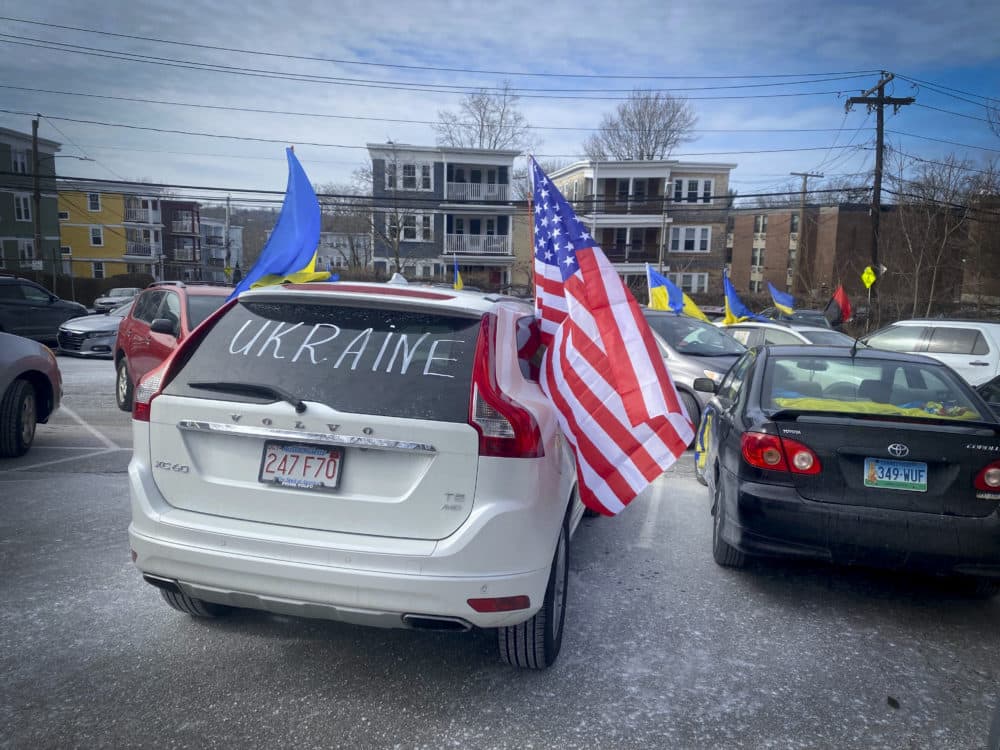 A vehicle adorned with American and Ukrainian flags prepares to drive from Jamaica Plain to Back Bay in a motorcade rally Sunday in solidarity with friends and family back home, as the threat of war with Russia intensifies. (Walter Wuthmann/WBUR)