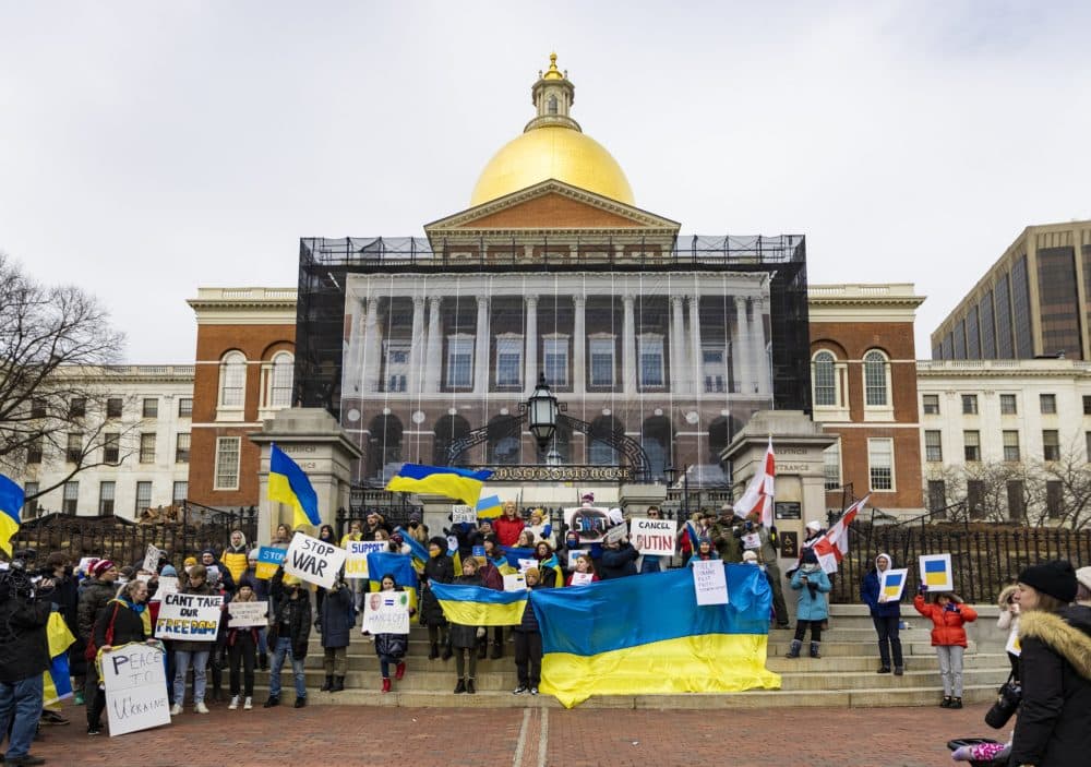 About 100 people gathered and chanted in front of the State House for a rally to support Ukraine. (Jesse Costa/WBUR)