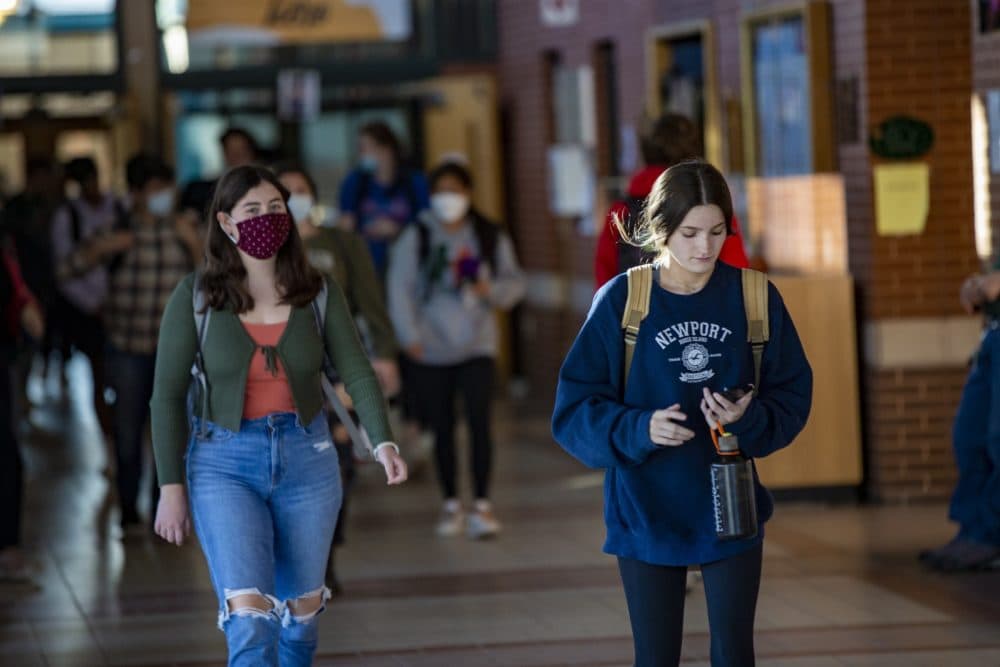 Students begin to file out at dismissal through the corridor of Hopkinton High School. Vaccinated students were not required to wear masks during a three-week trial in November 2021. (Jesse Costa/WBUR)