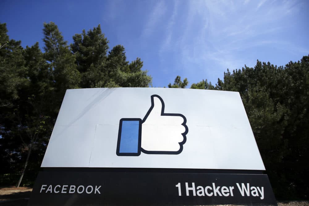The thumbs up Like logo is shown on a sign at Facebook headquarters in Menlo Park, Calif. (AP Photo/Jeff Chiu, File)